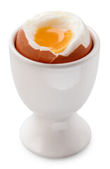 Soft -boiled partly peeled chicken egg with soft yolk in egg cup.
