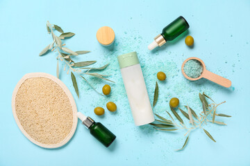 Composition with natural cosmetic products, green olives and branches on color background