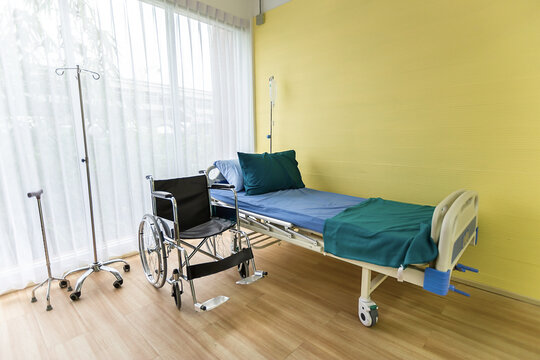 Hospital room with empty bed,infusion set , intravenous fluid and wheelchairs to creative for design and decoration on background.Copy space.