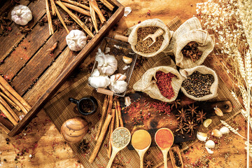 Top view of culinary seasonings & herbs, hot red chilli, white pepper, dried chilli powder in...