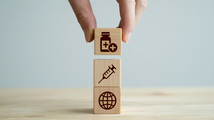 Global vaccination concept with hand stacking medicine and syringe blocks