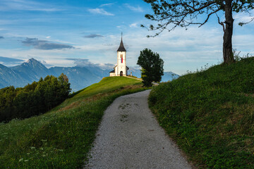 Idyllic summer afternoon view at the Church of Saint Primoz, near Jamnik, in Slovenia.