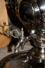 Vintage samovar on wooden background, close-up.