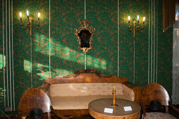 Luxury interior of a baroque style hotel room with green walls