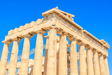 The building is a large, ancient structure with many columns