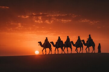 Silhouette of bedouins riding camels across sand dunes in the desert under a vibrant sunset sky