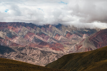 Colorful Hornocal mountain range in Jujuy under cloudy sky