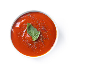 Homemade Tomato Soup in bowl with Basil isolated on white background. Top view. Copy space
