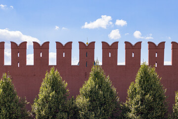 red brick fence and blue sky