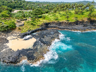 Sao Tome and Principe - Boca do Inferno Aerial View. Dramatic Coastal Cliffs and Palm-Lined...