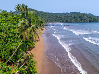 Sao Tome and Principe - Tortoise Beach Aerial View. Tropical Paradise With Golden Sand, Palm Trees, and Ocean Waves Near Praia Grande.	
