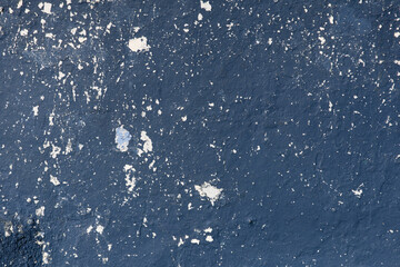 Vintage aged blue wall with texture showing effects of weather and time. Background photo. Copy Space