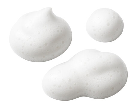 Three blobs of white bubbly foam on a clean, fresh surface.