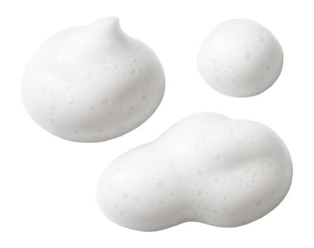 Three blobs of white bubbly foam on a clean, fresh surface.