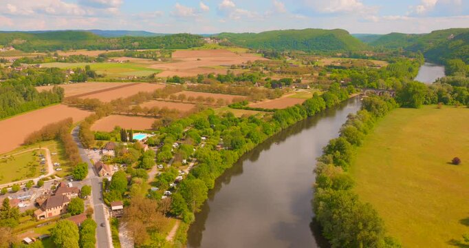 A breathtaking panoramic view from the historic Beynac Castle showcases the stunning Dordogne valley, capturing the essence of one of France's most officially beautiful villages.