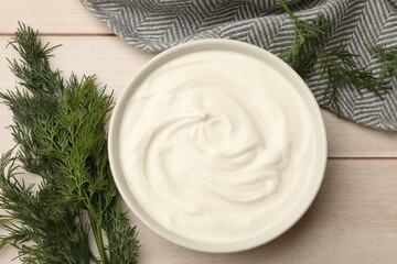 Tasty sour cream and dill on white wooden table, flat lay