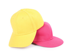 Pink and yellow baseball caps isolated on white. Mockup for design