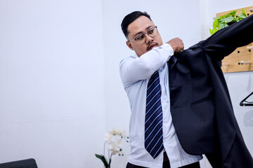 Man In A Hurry Puts On Suit Jacket, Getting Ready For Work