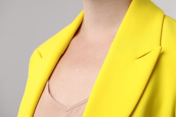 Closeup view of woman on grey background