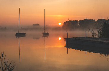 Sunrise over the lake. Sunny June morning.