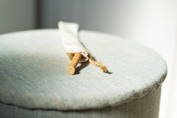 Organic Miswak Toothbrush Against a Gray Background