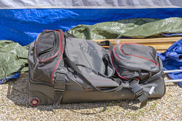 Half Full Big Gray Wheeled Duffle Bag Outside at Garvel
