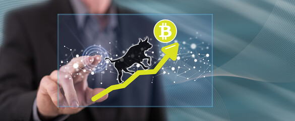 Man touching a bitcoin bullish trend concept