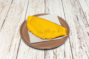 A variety of Creole empanadas showcasing different typical fillings: meat, chicken, cheese, and...