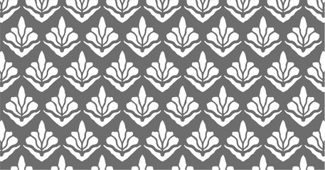 Seamless black and white floral motif with bold petal shapes in repetitive layout.