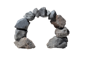 Circular stone archway, various shades of gray and brown.  Rough, irregular stones form a complete ring, creating an arch-like opening
