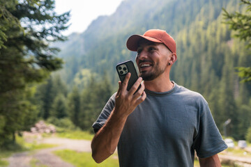 Tourist sending a voice message in transfăgărășan mountains, romania