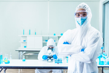 Two asian scientist team reserch chemistry science tube experiment biotech antibody sample in...