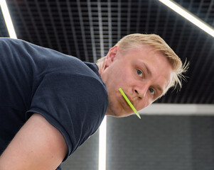 A car wrapping specialist applies a polyurethane film to the car. Detailer smoothes PPF. Car...