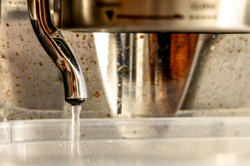 Cleaning the nozzle of a pressure coffee machine, repairing the machine, maintenance, descaling the...