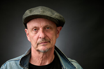 Portrait of a senior man in a vintage Harcourt style lighting