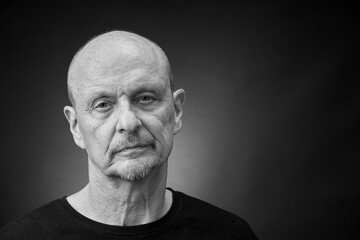 Monochrome Portrait of a senior man in a vintage Harcourt style lighting