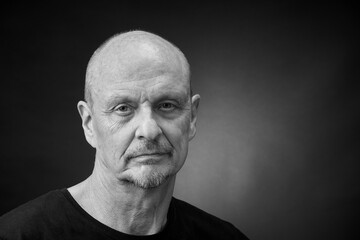 Monochrome Portrait of a senior man in a vintage Harcourt style lighting