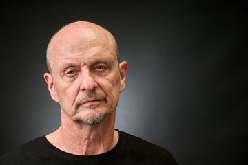 Portrait of a senior man in a vintage Harcourt style lighting