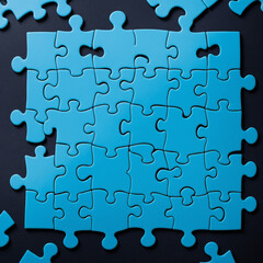 Fototapeta premium Puzzle pieces on background, blue jigsaw puzzle pieces copy space for text, top view