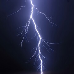 Powerful lightning strike illuminates the night sky, ideal for conveying dramatic weather, electricity, or raw natural power in your designs
