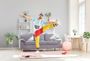 Funny cute sportsman doing morning exercises for strong body muscle building, playful fitness comedian, sporty humorist, fit clown in bright amusing sportswear, athlete health enthusiast fitness freak