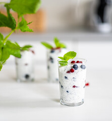 Yogurt Chia Seed Dessert With Red Currants And Blueberries