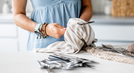 Woman Is Wiping Knives And Forks