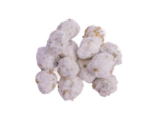 Spoiled candlenuts covered with mold, showing a white fuzzy layer and spots of decay, indicating...