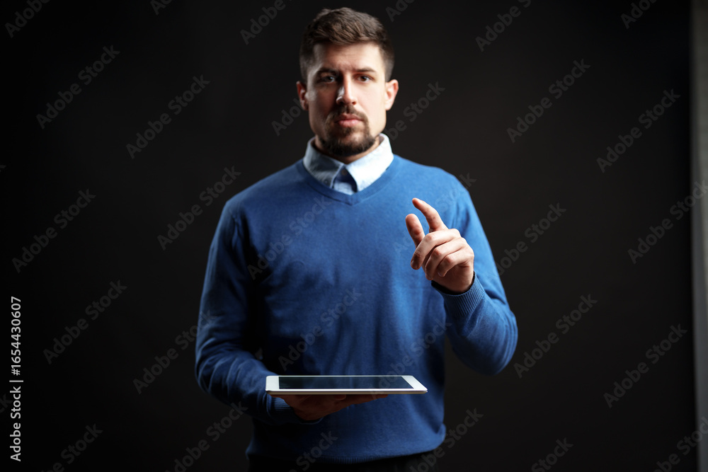 Poster presenting ideas with a tablet in a professional setting during a studio session