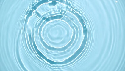 A close-up view of concentric circles rippling through a pale blue liquid surface, showcasing smooth textures and soft light.