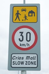 Warning about speed limit zone, where children maybe be playing football on the street, taken in Ireland.