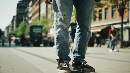 closeup of young skateboarder’s worn sneakers riding on city street. symbol of youth culture, freedom, sustainable transport. urban active lifestyle, european mobility week, sports concept