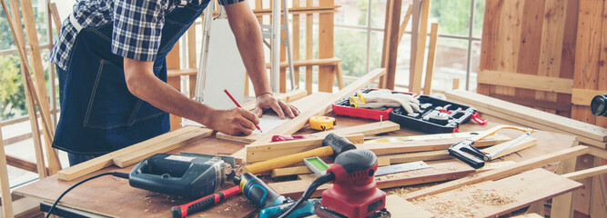 Banner DIY craftsperson asian man working wood heap carpenter objects woodwork desk. Banner...