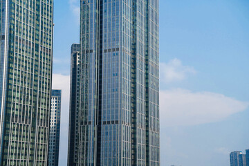 skyscraper with glass window and clear blue sky background for business and finance concept